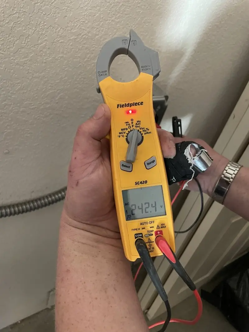 Voltage testing with clamp meter during Generator Installation in Highland Beach